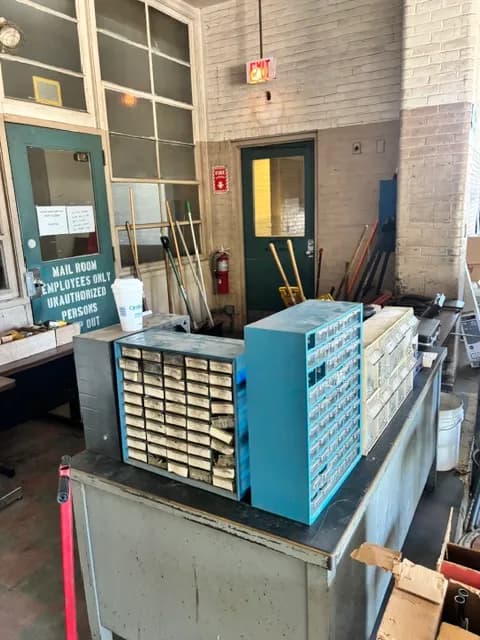 Office storage bins and equipment staged for liquidation.